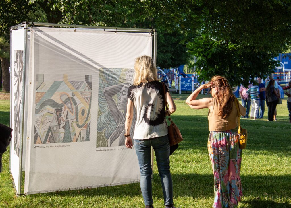 Visitors enjoying art at the Long Island Public Arts Festival – photo by Daniel Seagraves
